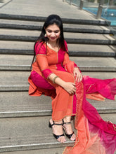 Salwar suit in brick and pink