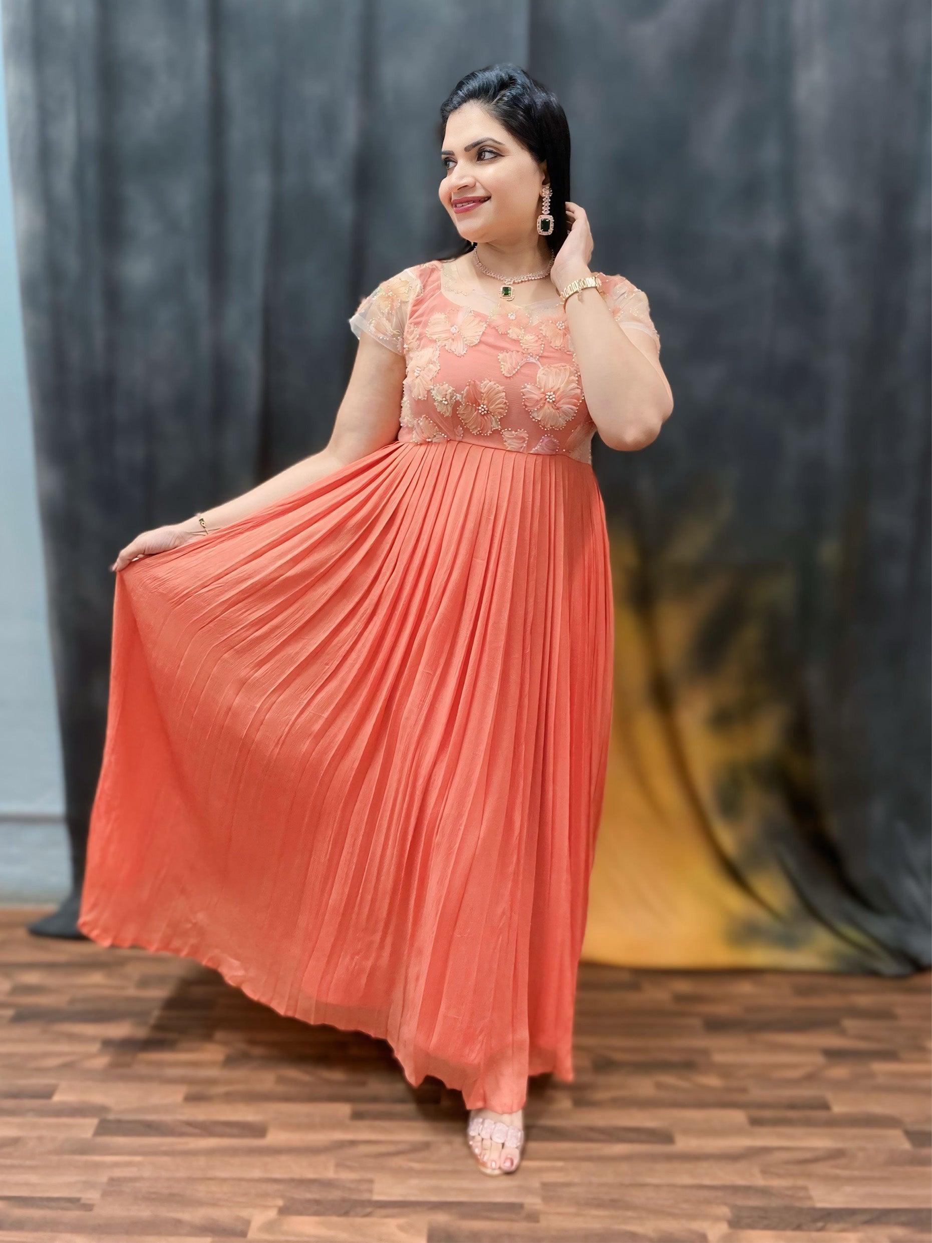 Peachish orange fully pleated gown
